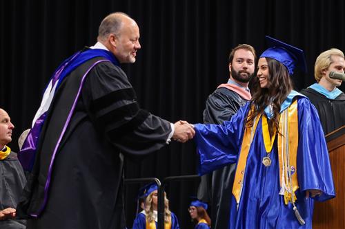 blue grad caps in the air